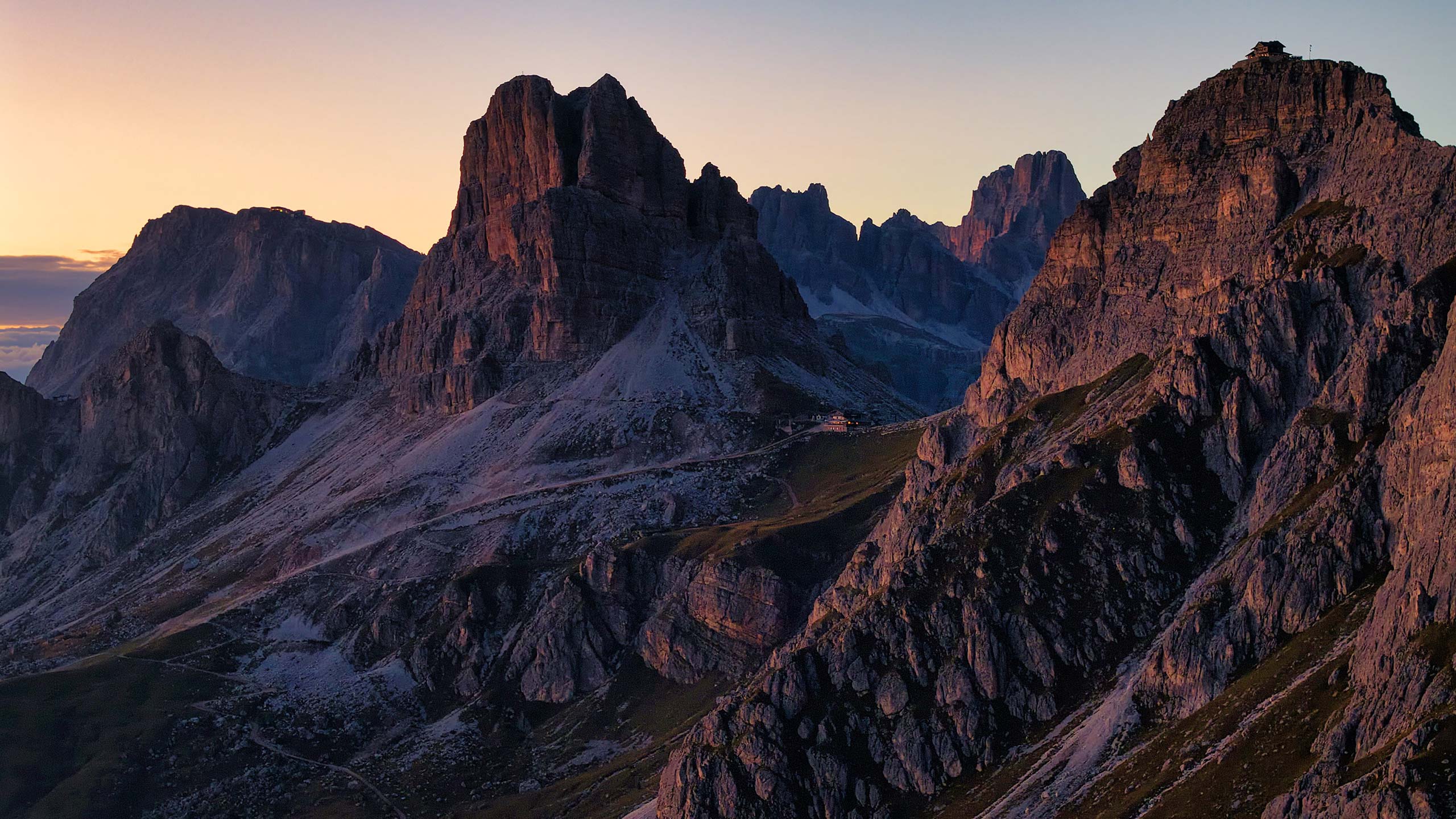 Dolomites at dawn — golden light over mountain ridges