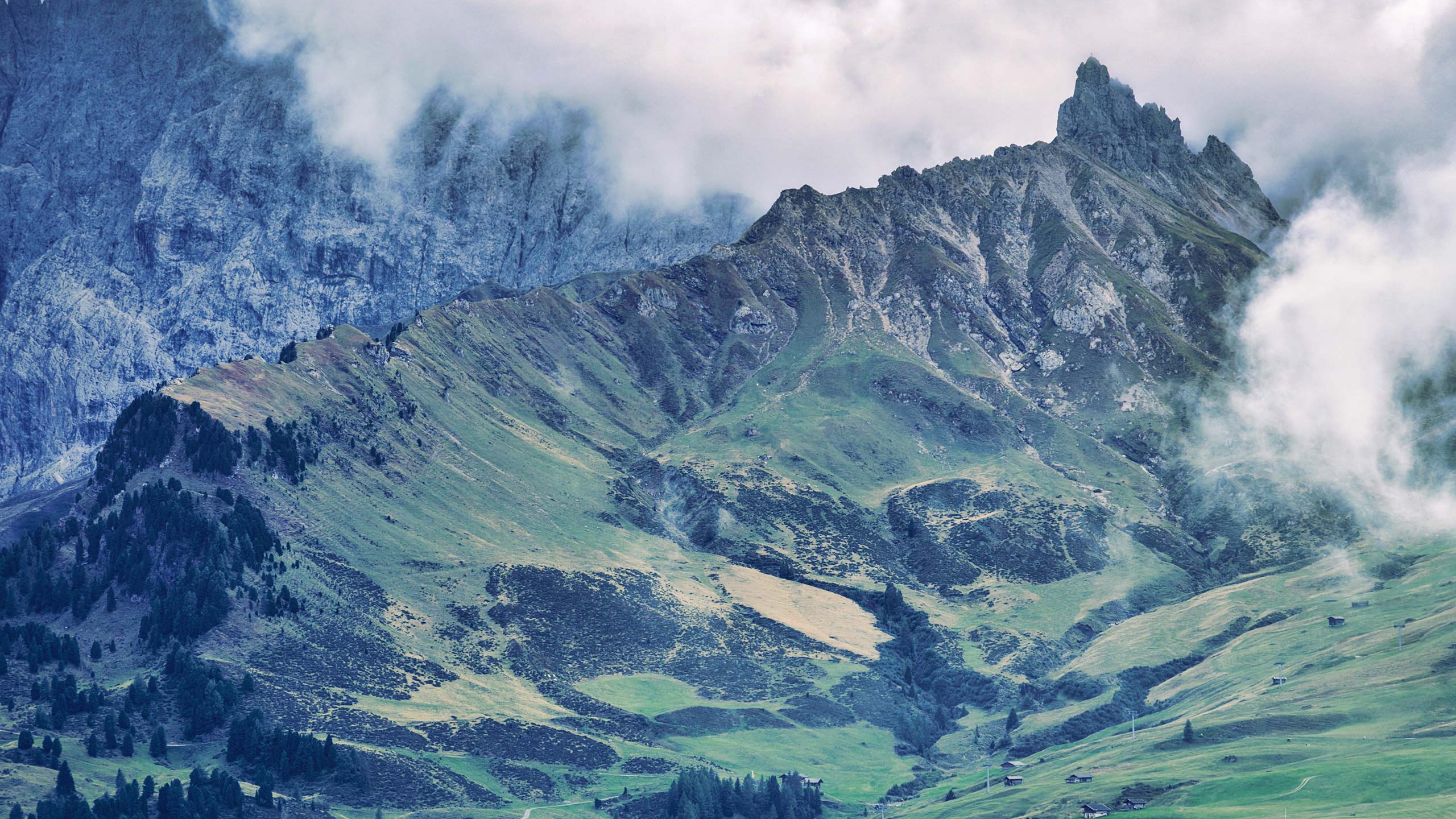 Mountain path ascending into clouds